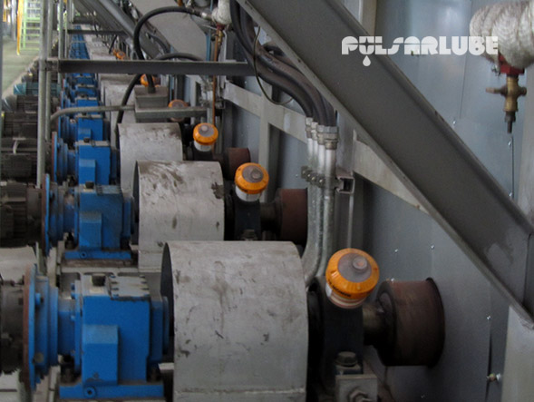 Pulsarlube V automatic single-point grease lubricators installed on industrial machinery bearing points